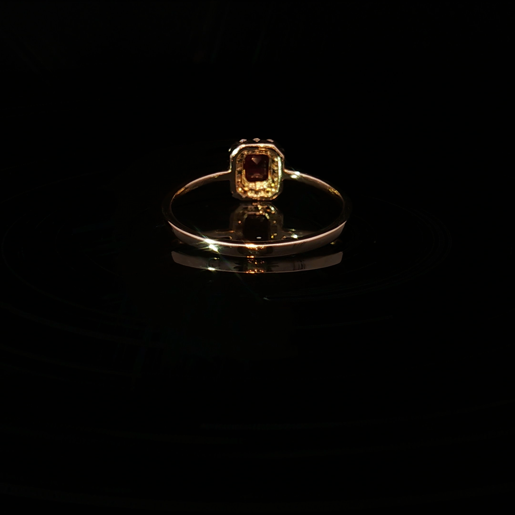 Yellow Gold Multistone Ring Featuring an Emerald Cut Ruby