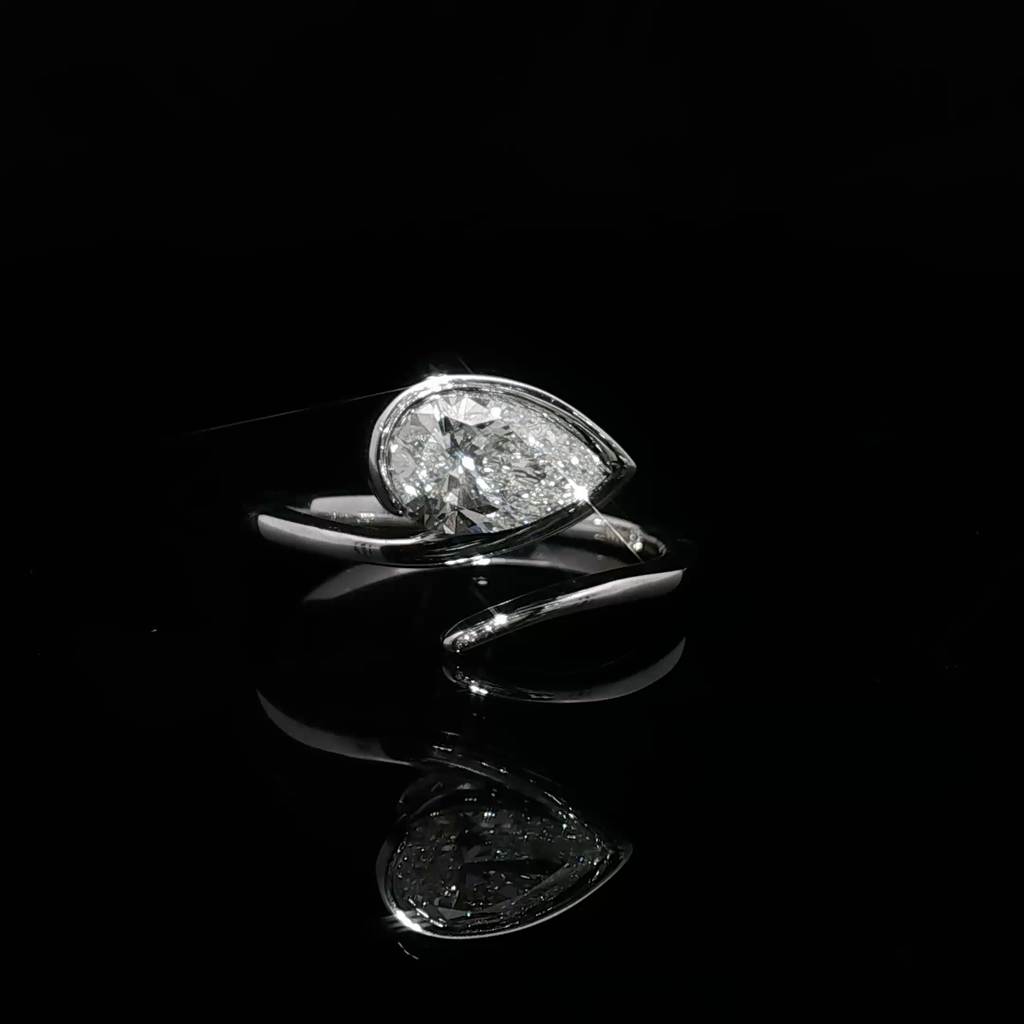White Gold Solitaire Wrapping Ring with Pear Cut Diamond