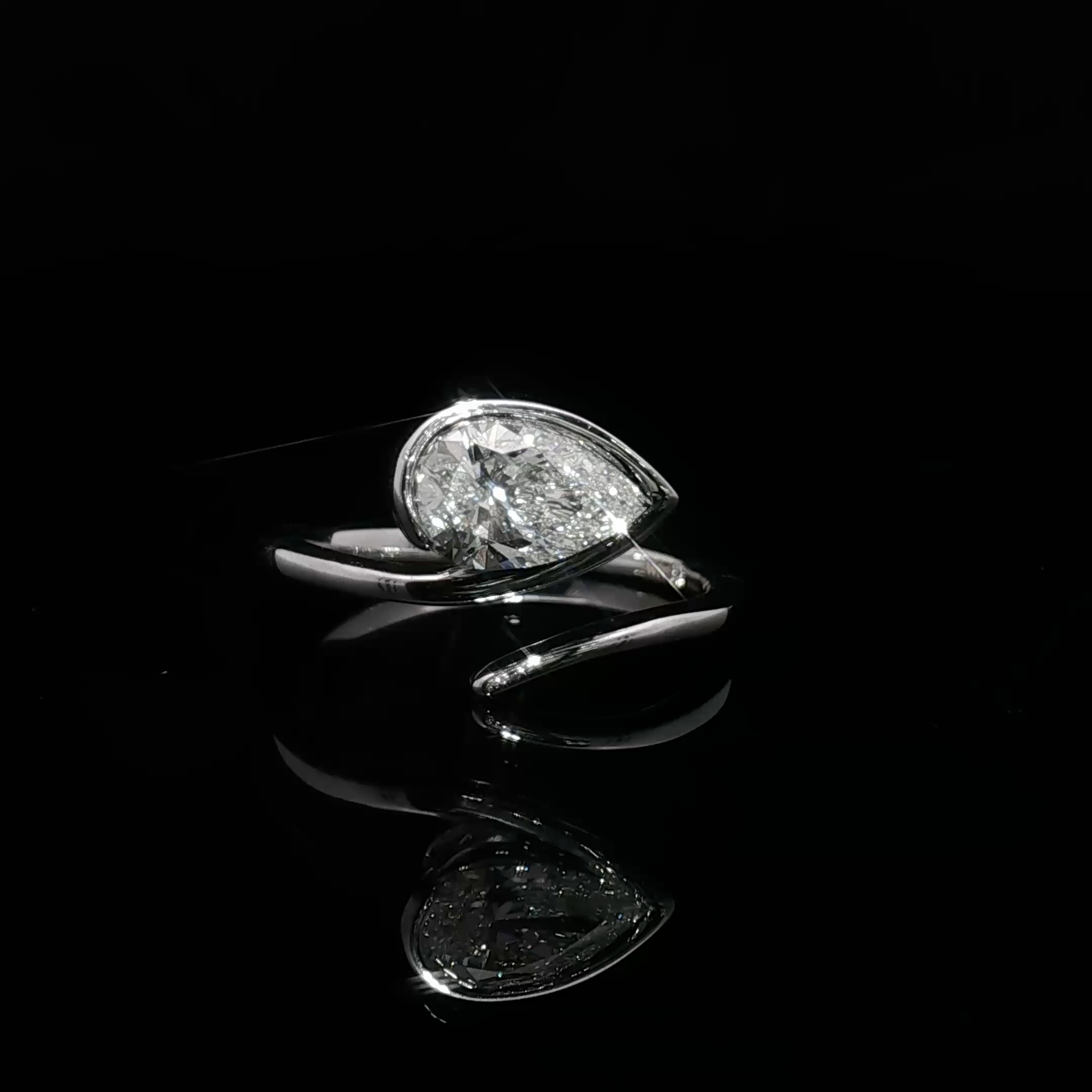 White Gold Solitaire Wrapping Ring with Pear Cut Diamond