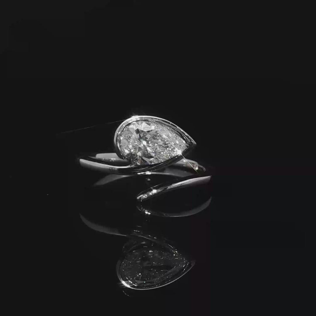 White Gold Solitaire Wrapping Ring with Pear Cut Diamond